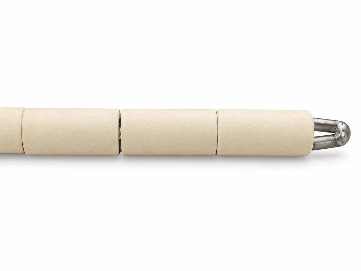 Ceramic K-type thermocouple tip showing insulating sleeves and welded metal junction