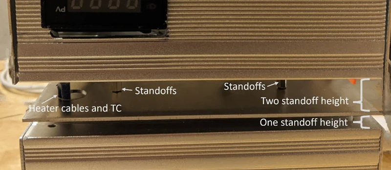 NASA Mark II oven standoff spacing and heater cable routing above the electronics enclosure