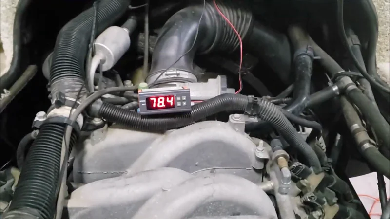 ThermoMart programmable temperature alarm operating beside a Workhorse 8.1 Vortec motorhome engine